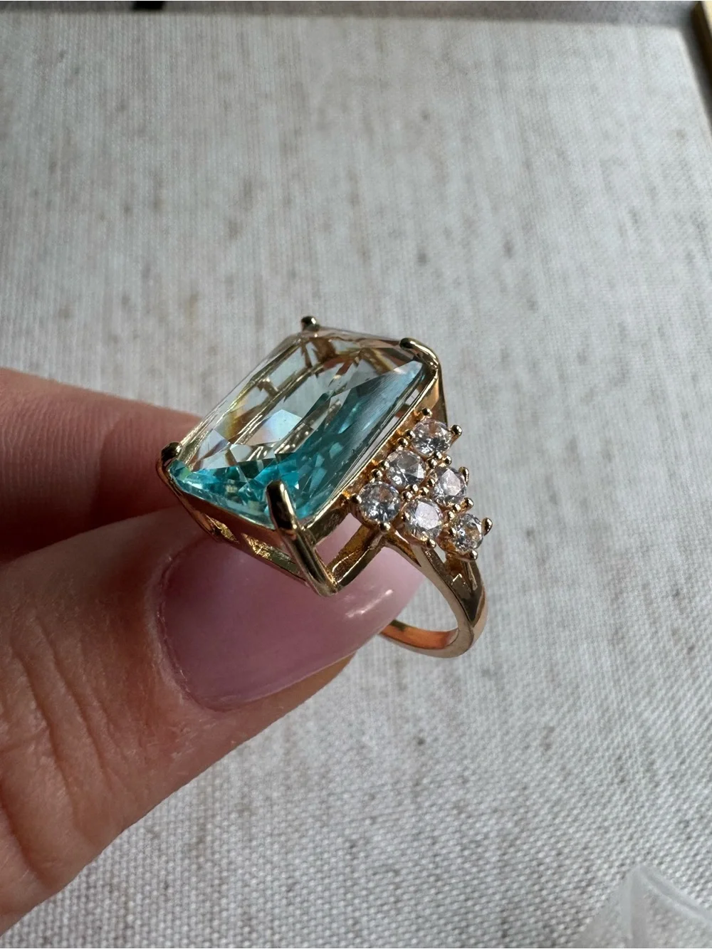 Stunning gold tone ring with blue crystal
